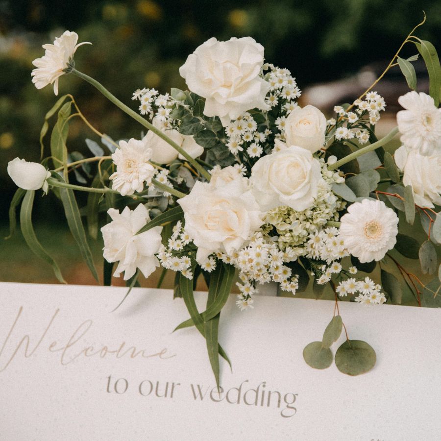 White wedding bouquet with welcome card